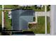 Aerial rooftop view of home, highlighting fenced yard, patio, and landscaping at 12140 74Th St, Largo, FL 33773