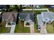 Aerial view of a well-manicured home featuring lush lawn and convenient driveway at 12140 74Th St, Largo, FL 33773