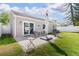 Cozy backyard with patio and grilling area, perfect for outdoor entertaining and relaxation at 12140 74Th St, Largo, FL 33773