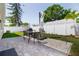 Inviting backyard with a paver patio, outdoor furniture, and manicured landscaping at 12140 74Th St, Largo, FL 33773