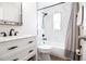 Bathroom with a stylish vanity, modern fixtures, and tiled shower-tub combo at 12140 74Th St, Largo, FL 33773