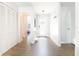 Bright entryway with wood floors, white walls, closet, and a view into the living area at 12140 74Th St, Largo, FL 33773