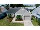 Charming single-story home with landscaped front yard and attached garage at 12140 74Th St, Largo, FL 33773