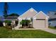 Charming single-story home with neutral paint, manicured landscaping, and a two-car garage at 12140 74Th St, Largo, FL 33773