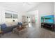 Bright living room with light walls, high ceiling, natural light, and open to the dining area at 12140 74Th St, Largo, FL 33773