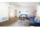 Open living room with vaulted ceilings, neutral walls, ceiling fan, and wood-look flooring at 12140 74Th St, Largo, FL 33773