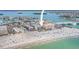 Aerial view of a beachfront condominium complex near a sandy beach at 12924 Gulf Blvd # 502, Madeira Beach, FL 33708