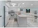 Well-lit kitchen features modern appliances, and a view of the dining area at 12924 Gulf Blvd # 502, Madeira Beach, FL 33708
