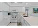 Bright white kitchen with modern appliances and plenty of counter space at 12924 Gulf Blvd # 502, Madeira Beach, FL 33708