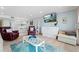 Comfortable living room area with access to kitchen, dining and balcony at 12924 Gulf Blvd # 502, Madeira Beach, FL 33708