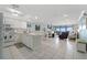 Open living space with kitchen, living, and dining areas, and ocean view at 12924 Gulf Blvd # 502, Madeira Beach, FL 33708