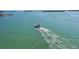 Breathtaking ocean view featuring boat sailing towards the horizon and clear, turquoise waters at 12924 Gulf Blvd # 502, Madeira Beach, FL 33708