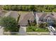 An aerial view showcases this single Gathering home, featuring a manicured lawn and an attached two-car garage at 12934 Tikal Way, Trinity, FL 34655