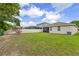 A spacious backyard with a well-maintained lawn, perfect for outdoor activities and relaxation at 12934 Tikal Way, Trinity, FL 34655
