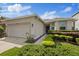 This single-story home is enhanced by manicured landscaping and features a convenient two-car garage at 12934 Tikal Way, Trinity, FL 34655