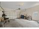 Spacious garage with ample room for parking and storage, featuring an automatic door at 12934 Tikal Way, Trinity, FL 34655