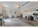 Large garage interior with shelving and storage, providing ample space for vehicles and belongings at 12934 Tikal Way, Trinity, FL 34655