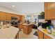 Bright kitchen with wood cabinets, stainless steel appliances, and tile flooring at 12934 Tikal Way, Trinity, FL 34655