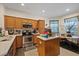 Modern kitchen with a center island, stainless steel appliances, and tile flooring at 12934 Tikal Way, Trinity, FL 34655