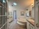 Relaxing bathroom featuring a jacuzzi tub, dual sinks, vanity, and decorative accents at 131 E Saint Annes Cir, Apollo Beach, FL 33572