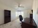 Bright office with a ceiling fan, large window, desk, and ample workspace at 131 E Saint Annes Cir, Apollo Beach, FL 33572