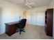 Office space with neutral walls, a ceiling fan, desk, and storage shelving at 131 E Saint Annes Cir, Apollo Beach, FL 33572
