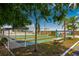 Community shuffleboard courts with picnic tables in a landscaped area at 131 E Saint Annes Cir, Apollo Beach, FL 33572