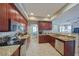 Well-lit kitchen features granite countertops and stainless steel appliances at 16114 Bridgecrossing Dr, Lithia, FL 33547