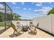 The patio area offers a nice outdoor living area with fire pit and view of the green space behind the home at 16323 Muirfield Dr, Odessa, FL 33556