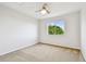 Cozy bedroom with neutral carpet and a large window providing natural light at 16323 Muirfield Dr, Odessa, FL 33556