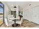 Cozy eat-in kitchen with a white table, seating for four, and lots of natural light at 16323 Muirfield Dr, Odessa, FL 33556