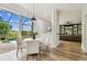 Eat-in kitchen featuring a view of the backyard pool and green space beyond at 16323 Muirfield Dr, Odessa, FL 33556