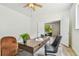 Bright home office featuring modern desk and chairs, and natural light at 16323 Muirfield Dr, Odessa, FL 33556