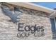 Eagles Golf Club stone sign with eagle logo and layered stone background at 16323 Muirfield Dr, Odessa, FL 33556