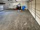 Large garage interior with concrete flooring, storage cabinets, and space for multiple vehicles at 1715 Delaware Ne Ave, St Petersburg, FL 33703