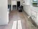 View of a kitchen featuring tile floors and updated white cabinets at 1715 Delaware Ne Ave, St Petersburg, FL 33703