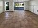 Enclosed sunroom featuring tile floors and sliding glass doors to the outdoor pool area at 1715 Delaware Ne Ave, St Petersburg, FL 33703