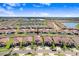 Gorgeous aerial view of the neighborhood, highlighting the well-maintained landscaping and tranquil surroundings at 17214 Star Banks St, Wimauma, FL 33598