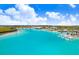 Stunning community pool features beach entry, cabanas, and inviting turquoise water at 17214 Star Banks St, Wimauma, FL 33598