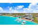 Aerial view of the resort-style community pool with cabanas, lounge chairs, and palm trees at 17214 Star Banks St, Wimauma, FL 33598