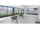 Relaxing screened patio with chairs and table overlooks the backyard at 17214 Star Banks St, Wimauma, FL 33598