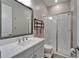 Modern bathroom with a glass-enclosed shower, a bright vanity, and brushed nickel fixtures at 19611 Cypress Bridge Dr, Odessa, FL 33556