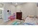 Bright bedroom with playful decor and direct access to a stylish bathroom at 19611 Cypress Bridge Dr, Odessa, FL 33556