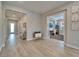 Hallway leads to an office space, a living area, and features unique decorations, with tiled flooring at 19611 Cypress Bridge Dr, Odessa, FL 33556