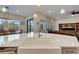 Kitchen island with stainless steel faucet, open to the dining and living areas, with a view of the pool at 19611 Cypress Bridge Dr, Odessa, FL 33556
