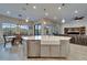 Kitchen island with stainless steel dishwasher and farmhouse sink, open to the dining and living areas at 19611 Cypress Bridge Dr, Odessa, FL 33556