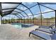 Relaxing screened pool with a spa and deck area, perfect for leisure and entertaining guests at 19611 Cypress Bridge Dr, Odessa, FL 33556