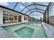 The pool area has a built-in spa and lots of space for relaxing and entertaining at 19611 Cypress Bridge Dr, Odessa, FL 33556
