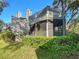 Charming condo with a screened-in porch, natural landscaping, and ample outdoor living space at 2011 Arbor Dr, Clearwater, FL 33760