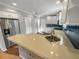 This is a contemporary kitchen with stainless steel appliances, light quartz countertops, and wood flooring at 2011 Arbor Dr, Clearwater, FL 33760